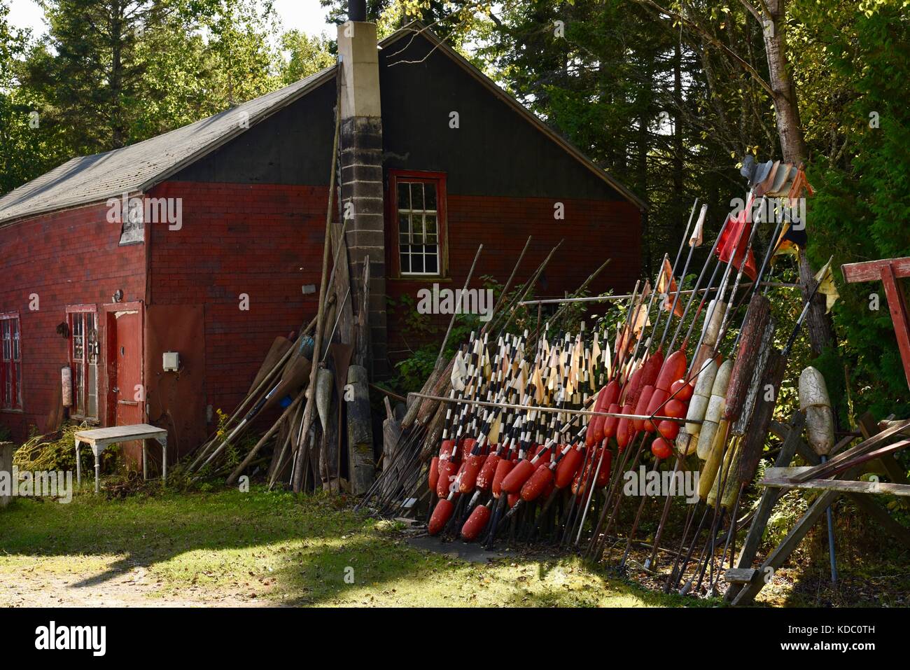 Buoys and markers piled up alongside fishing shed for Baileys Harbor