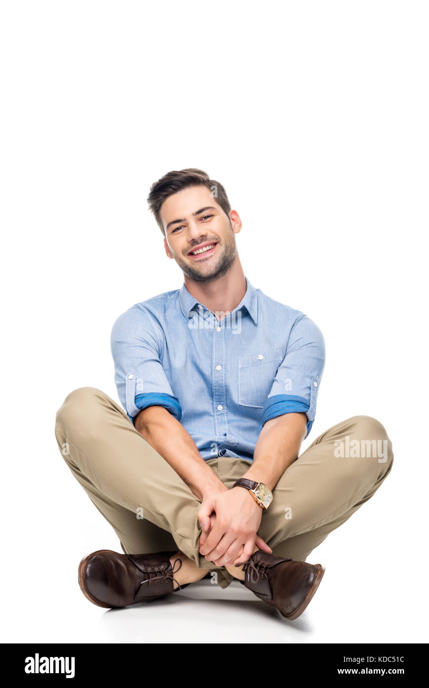 young man sitting on floor Stock Photo