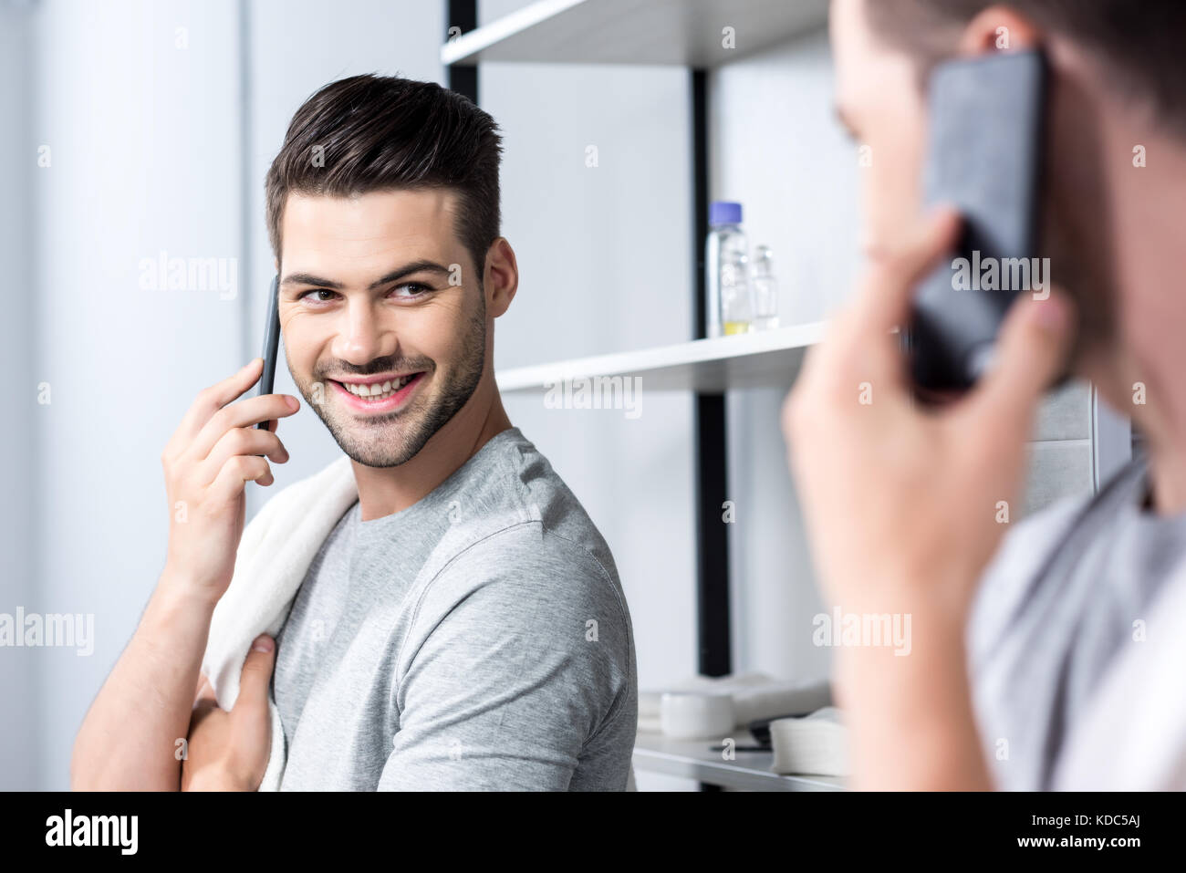 man talking by phone in bathroom Stock Photo Alamy