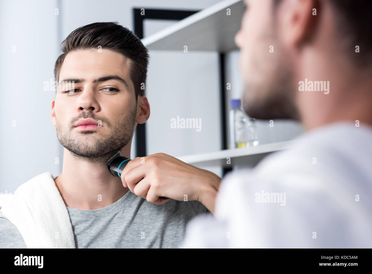 man shaving with electric trimmer Stock Photo