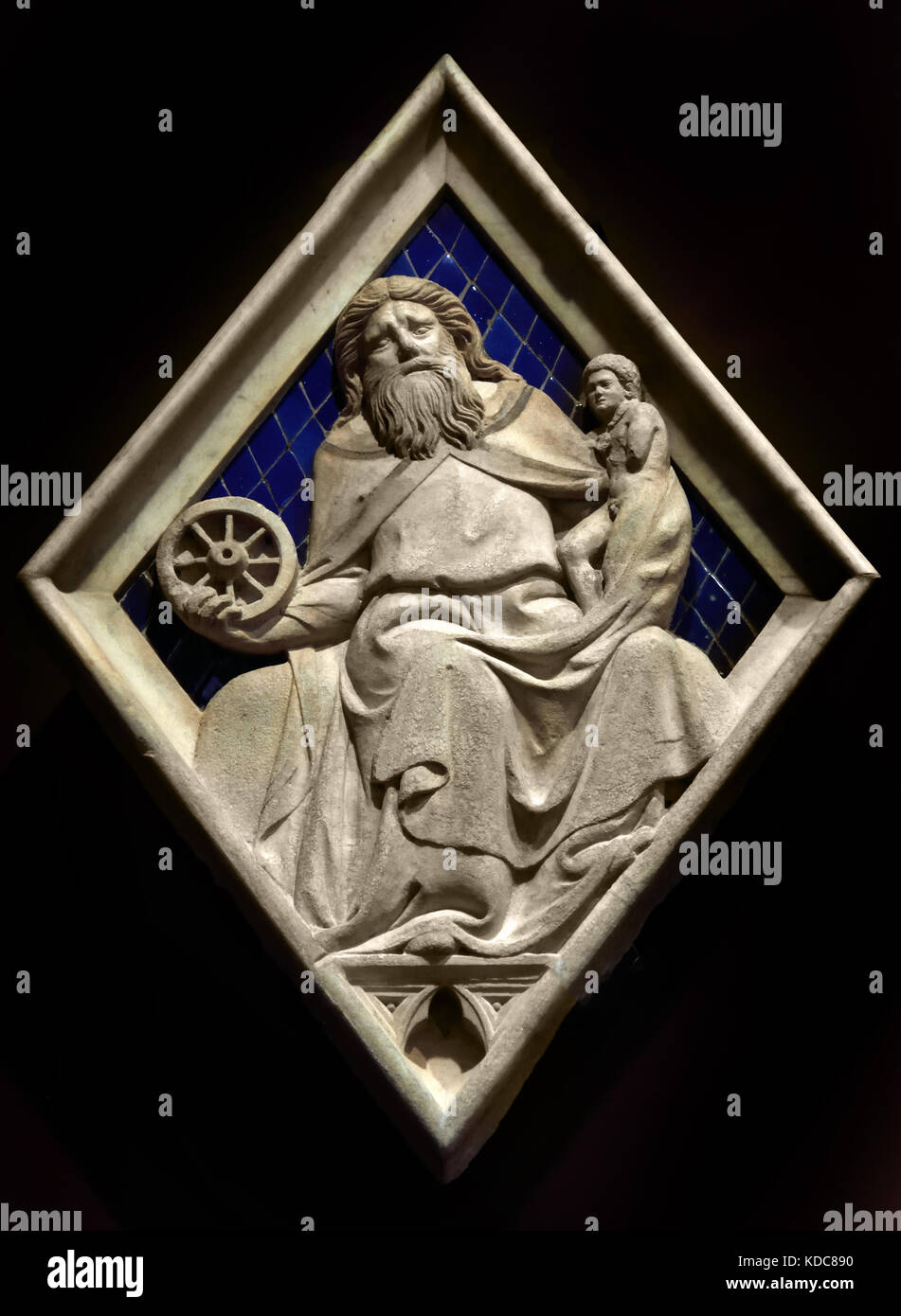 Saturn: Collaborator of Andrea Pisano (Master of Saturn) Pisano 1290 – 1348 is sculptor architect and Workshop began about 1336 with the reliefs for the Campanile ( The Cattedrale di Santa Maria del Fiore of Florence )1336 Florence Italy ( Museo dell' Opera del Duomo ) Cathedral of Saint Mary of the Flower Stock Photo