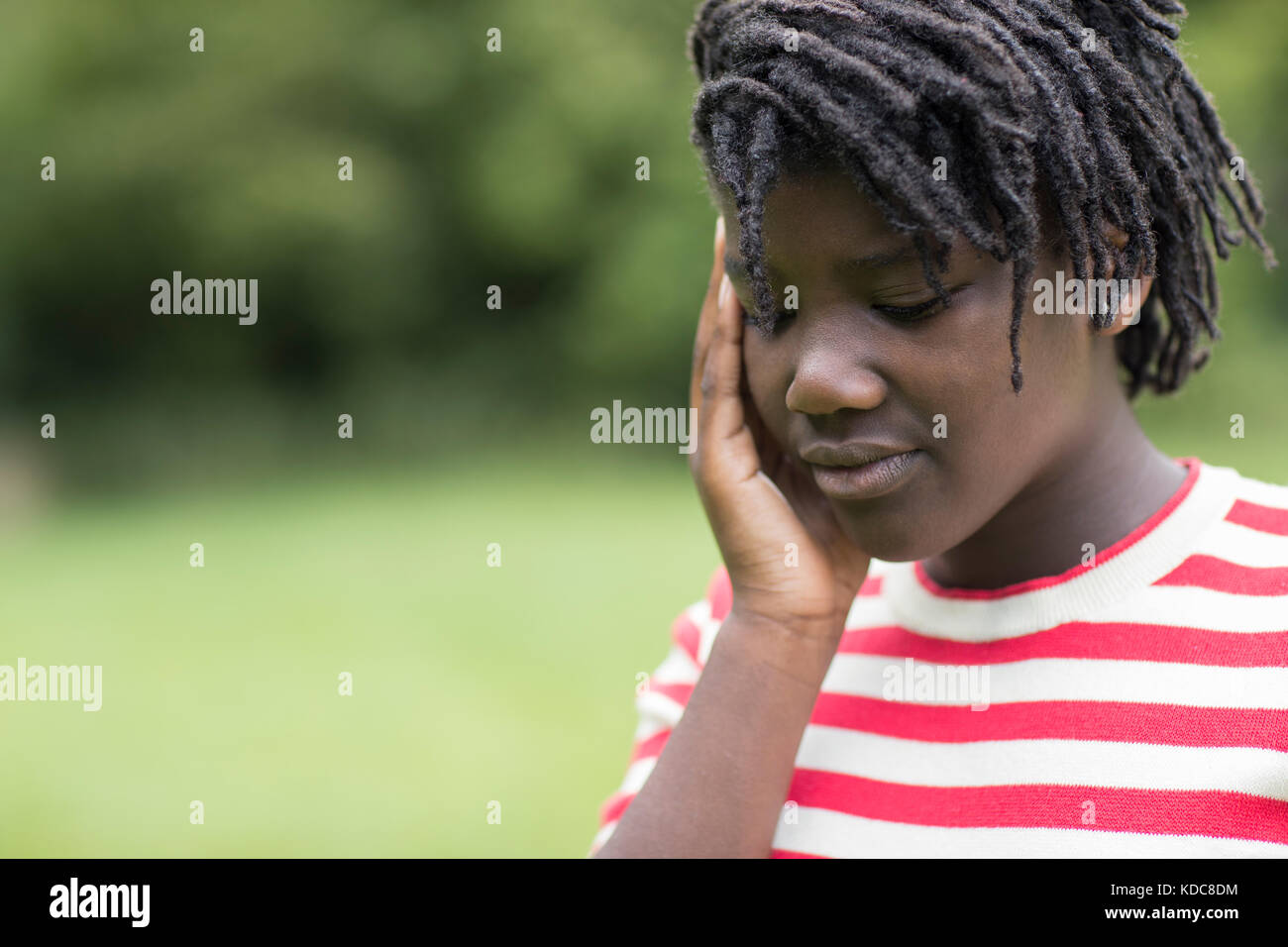 Outdoor Shot Of Stressed Teenage Girl Stock Photo