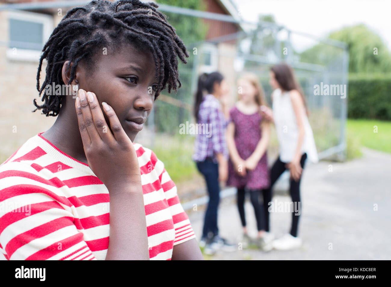 Sad Teenage Girl Feeling Left Out By Friends Stock Photo