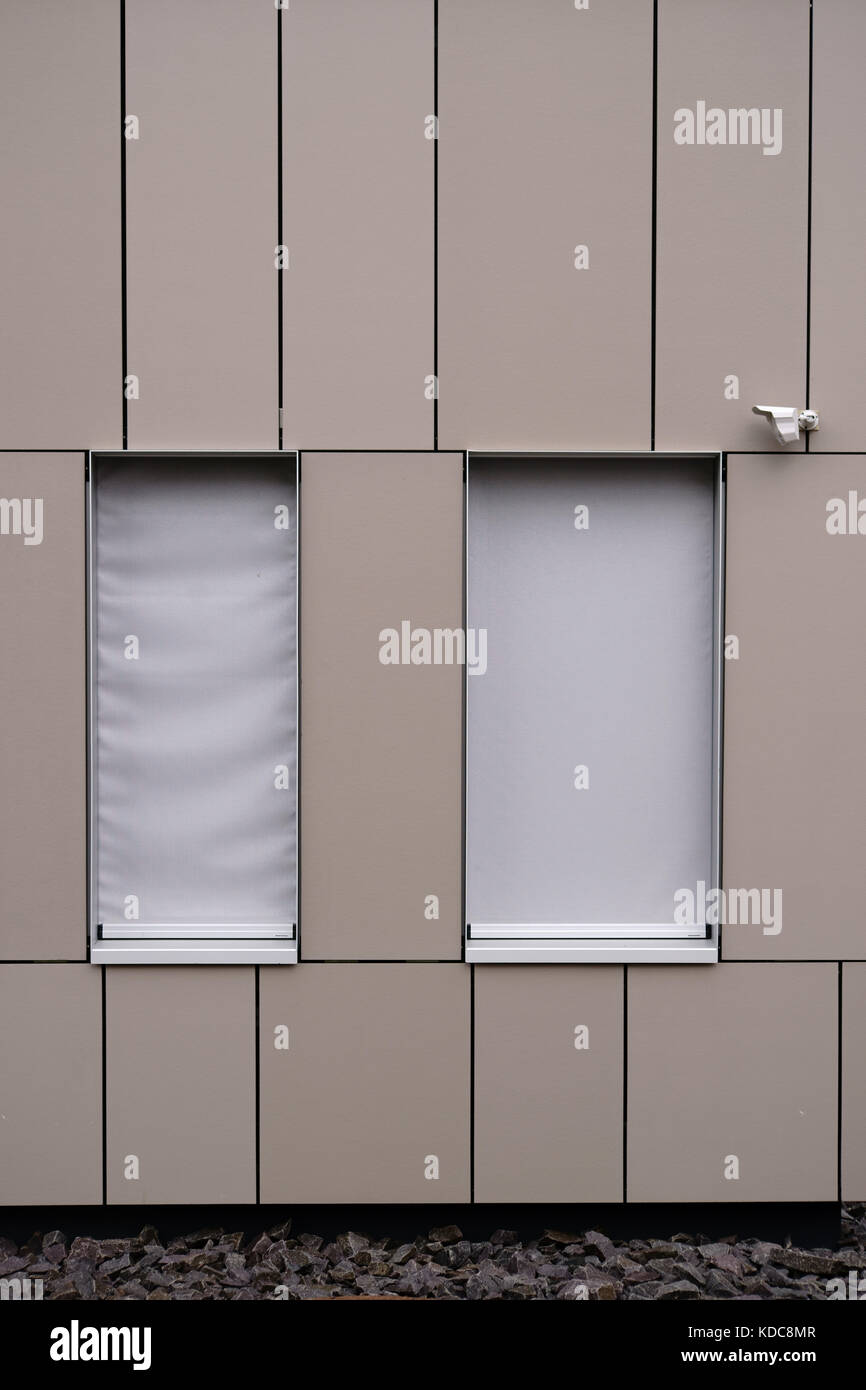 A modern house facade with sheet metal covering and an installed ...