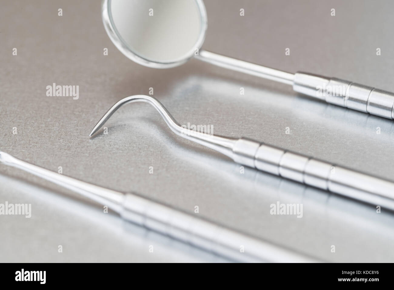 Close Up Of Dental Instruments On Metal Surface Stock Photo