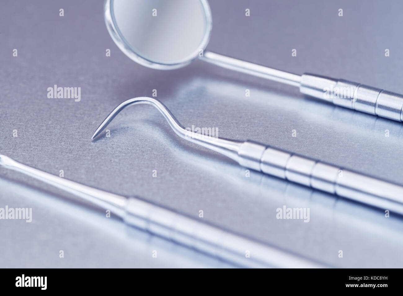 Close Up Of Dental Instruments On Metal Surface Stock Photo