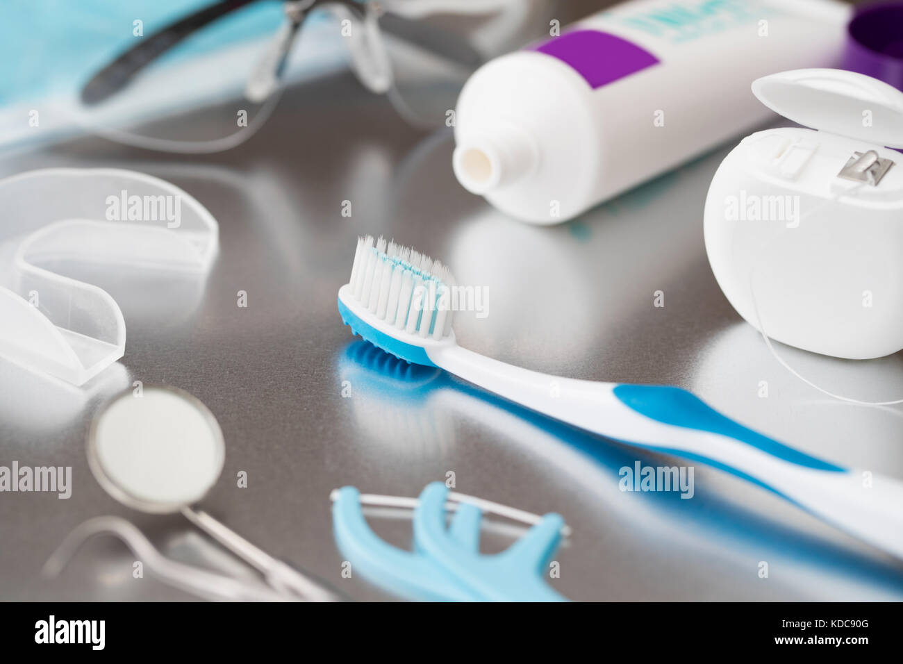 Selection Of Dental Health Treatments And Instruments On Metal Surface Stock Photo