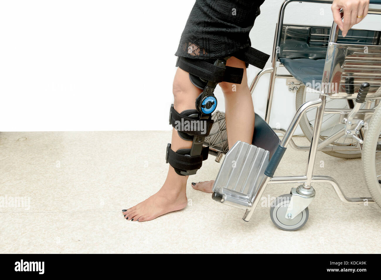 Patient on knee brace support try to walk training,Rehabilitation