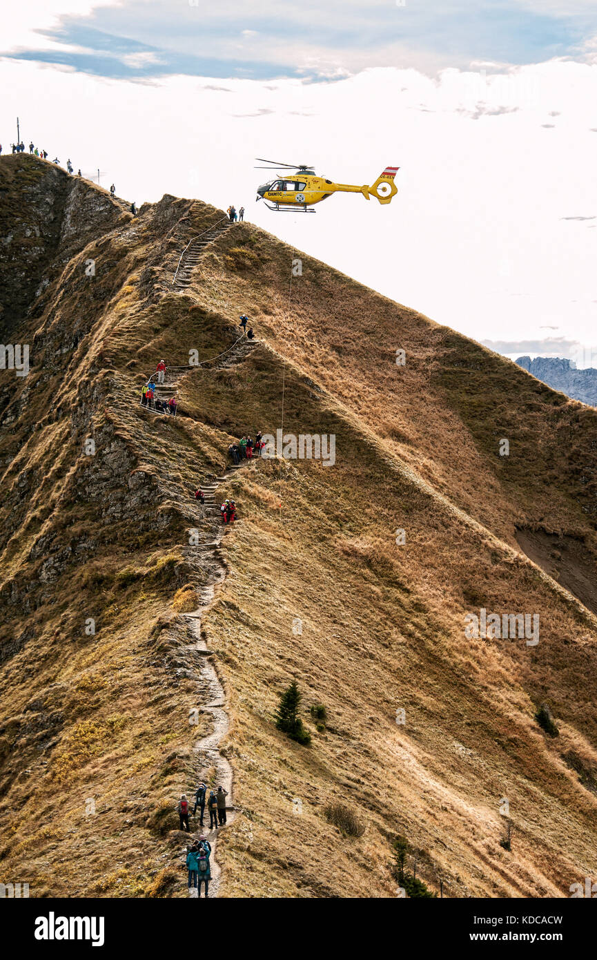 Mountain rescue by helicopter on Fellhorn ridge in Kleinwalsertal (Little Walser Valley)/Vorarlberg. Stock Photo