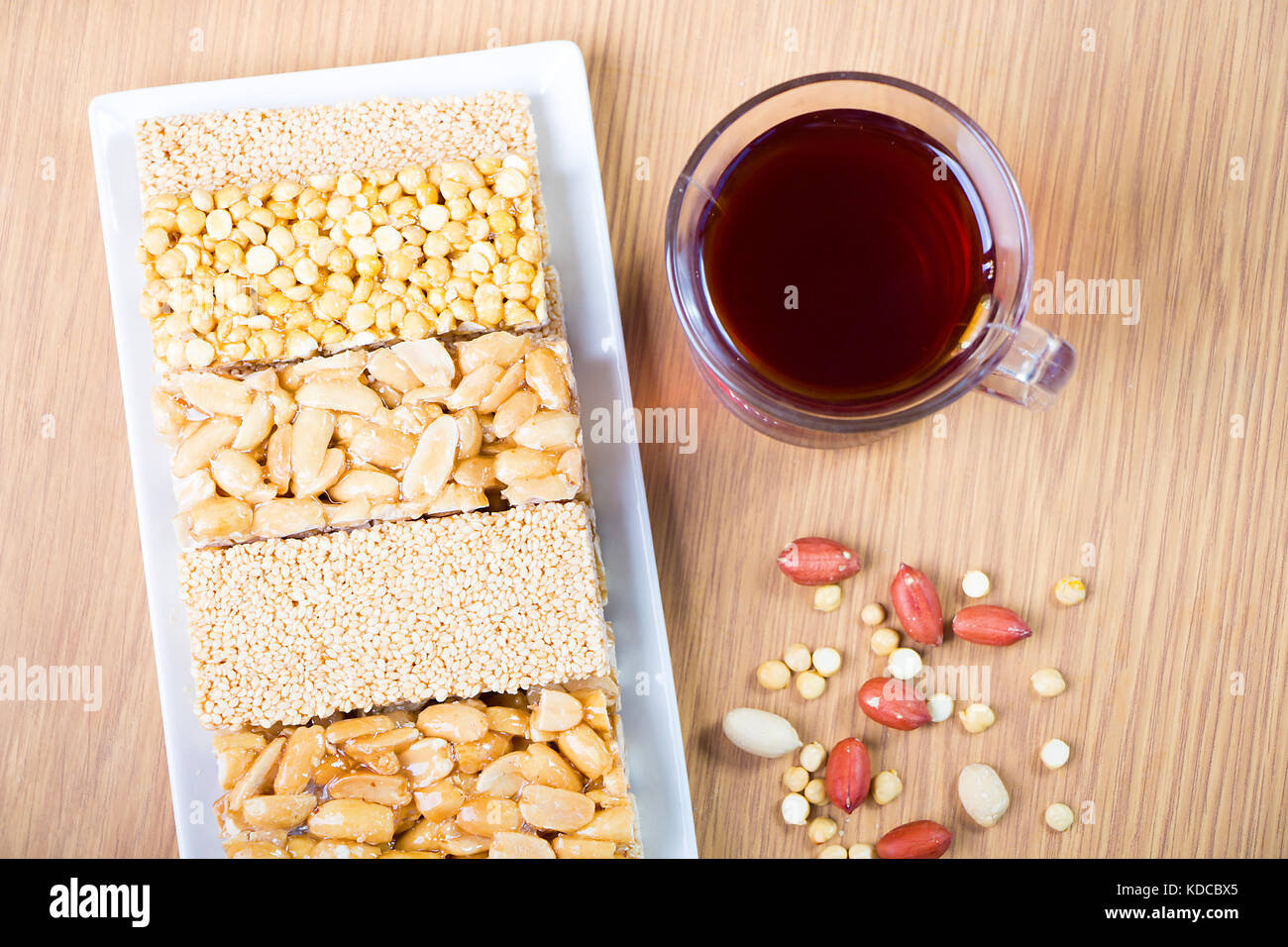 Collection of Beans Candies and Sweets Sweets ( Mawlid Halawa ) with Cup of tea - Egyptian Culture Dessert Eaten During Prophet Muhammad Birthday Stock Photo