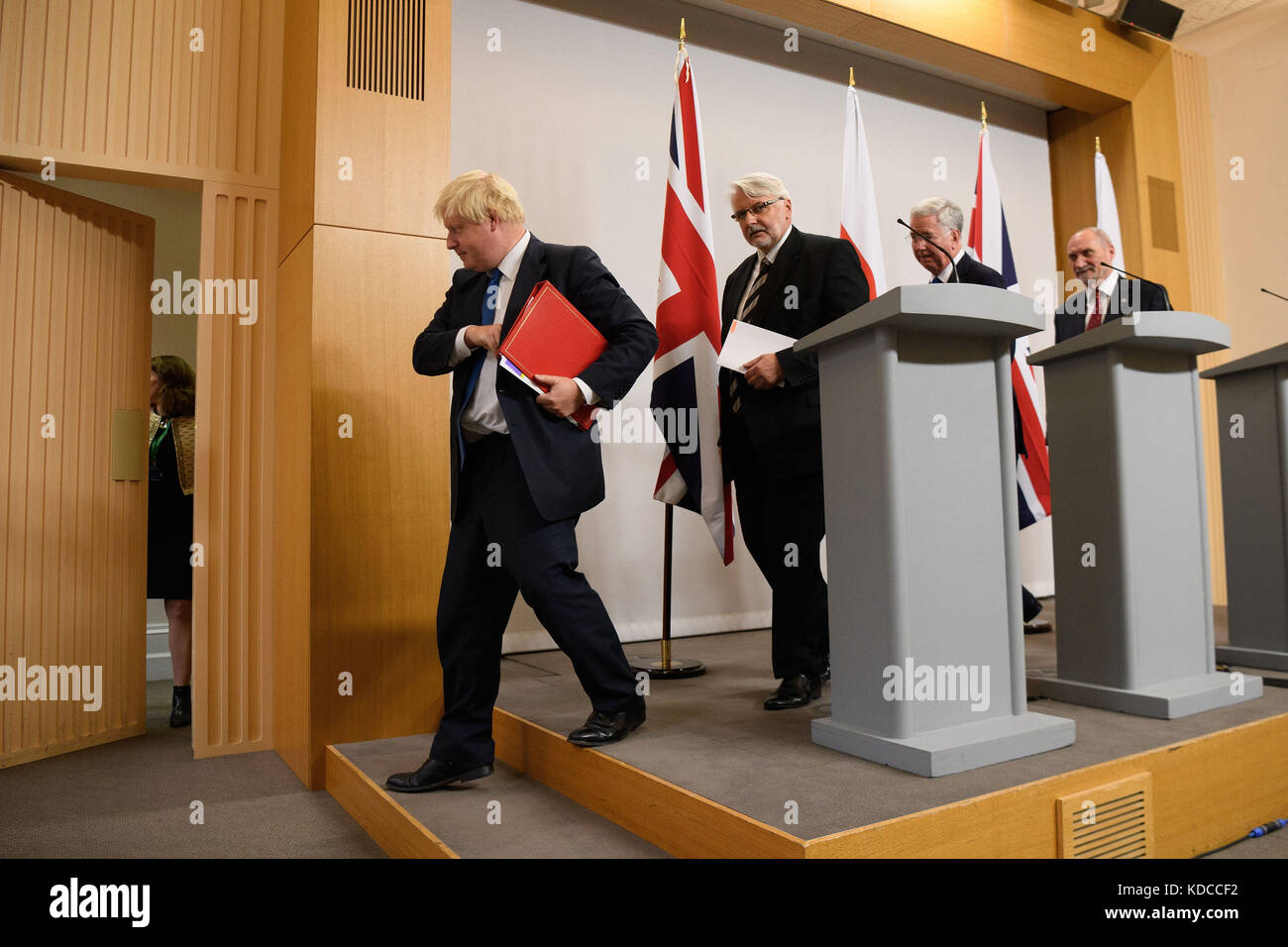 (left to right) Foreign Secretary Boris Johnson, Poland's Foreign Minister Witold Waszczykowksi, Defence Secretary Sir Michael Fallon and Polish Defence Minister Antoni Macierewicz, leave following a joint press conference at the Foreign & Commonwealth Office in London. Stock Photo