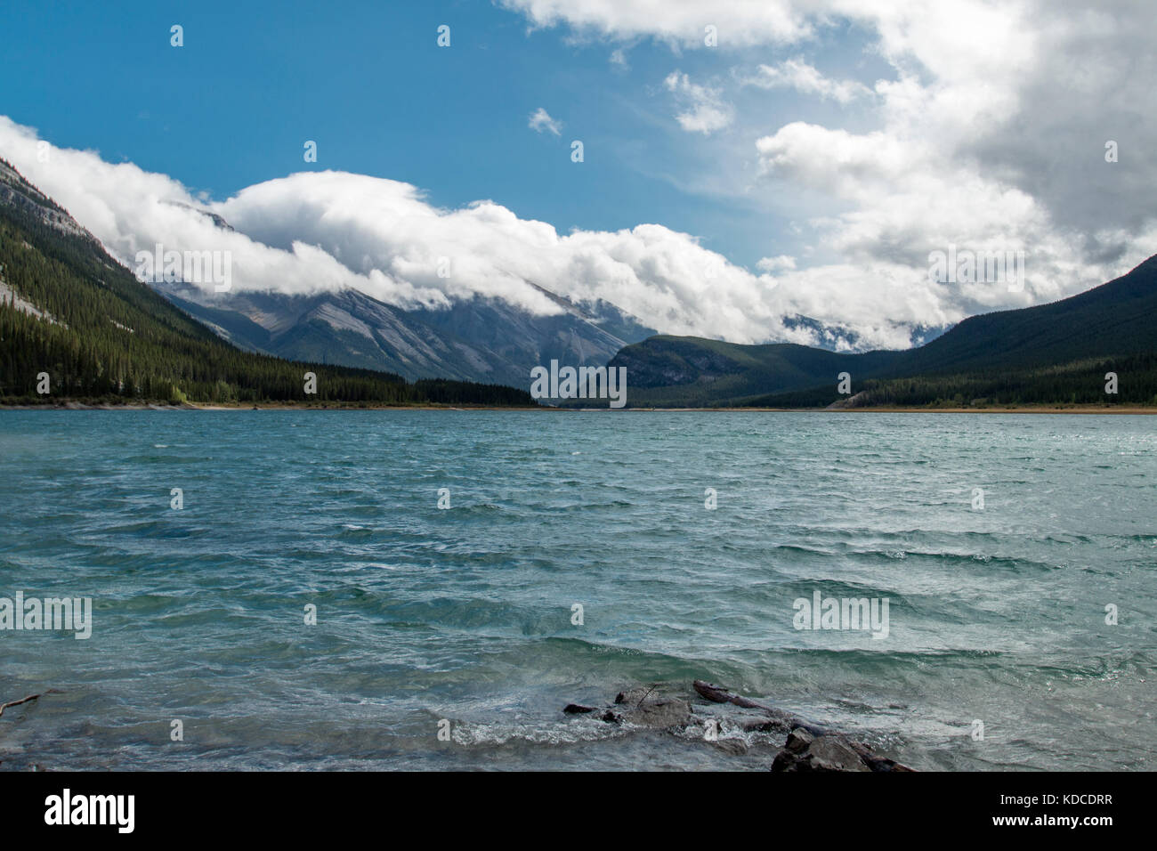Beautiful mountains serve as a backdrop to the Spray Lakes Reservoir in Kananaskis country. Stock Photo