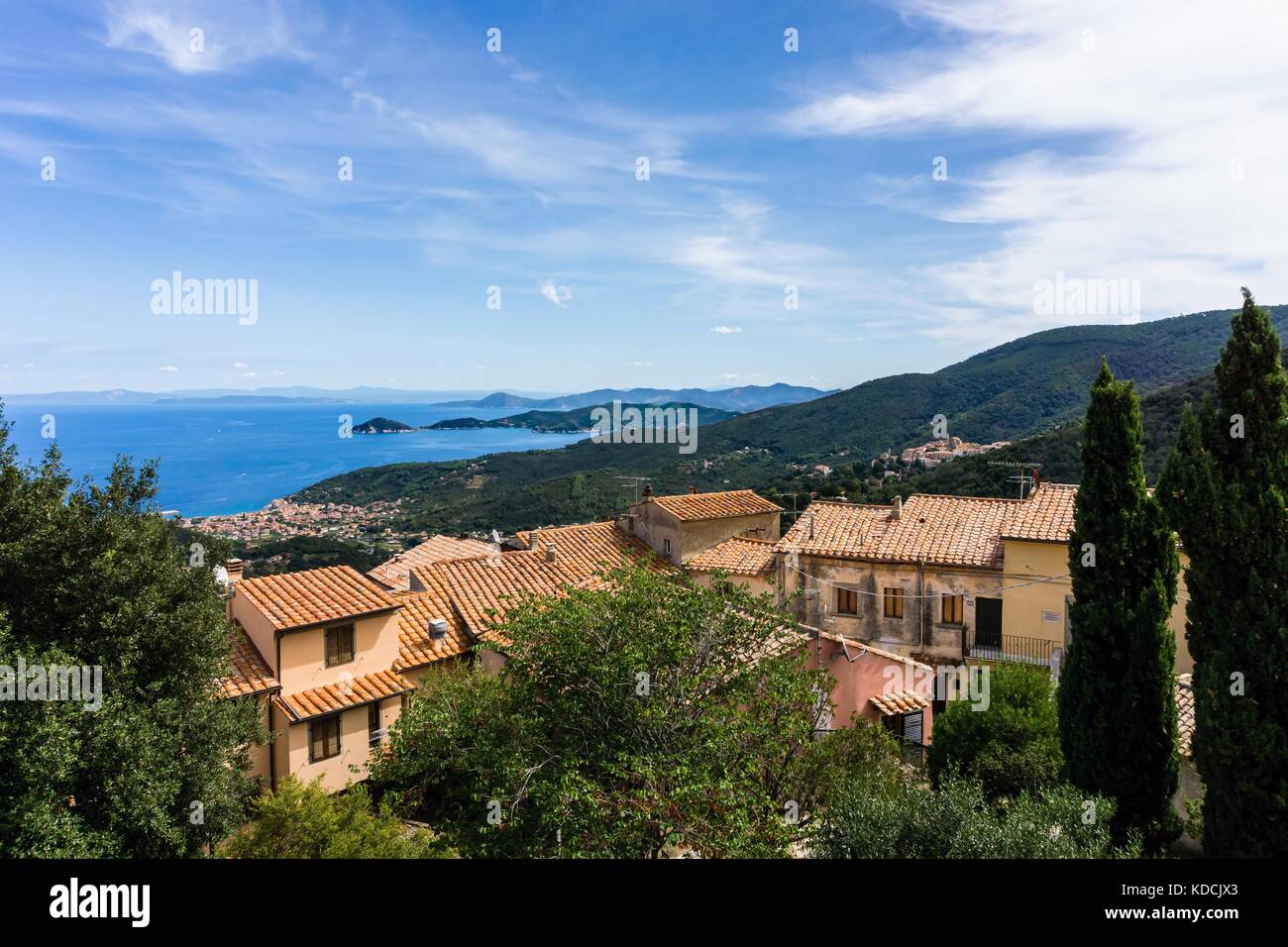 Vertical photo with view on the bay of town Marciana Marina on the coast of Elba island. The view is over few houses of small historical village Marci Stock Photo