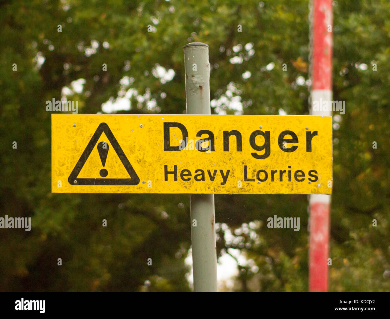 yellow rectangle road sign on pole danger heavy lorries; essex; england