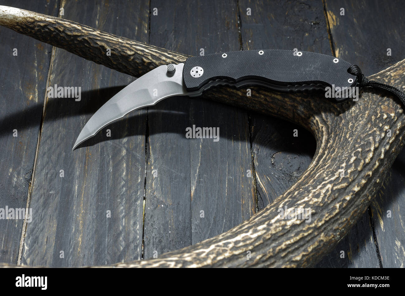 Bat knife. Knife for combat operations. Black army knife Stock Photo