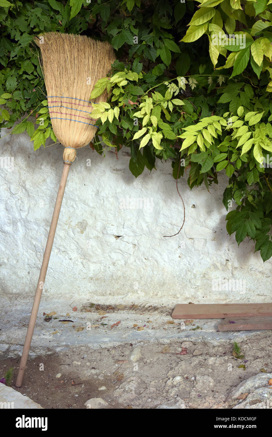 a broom, brush or besom made from twigs in the traditional way or