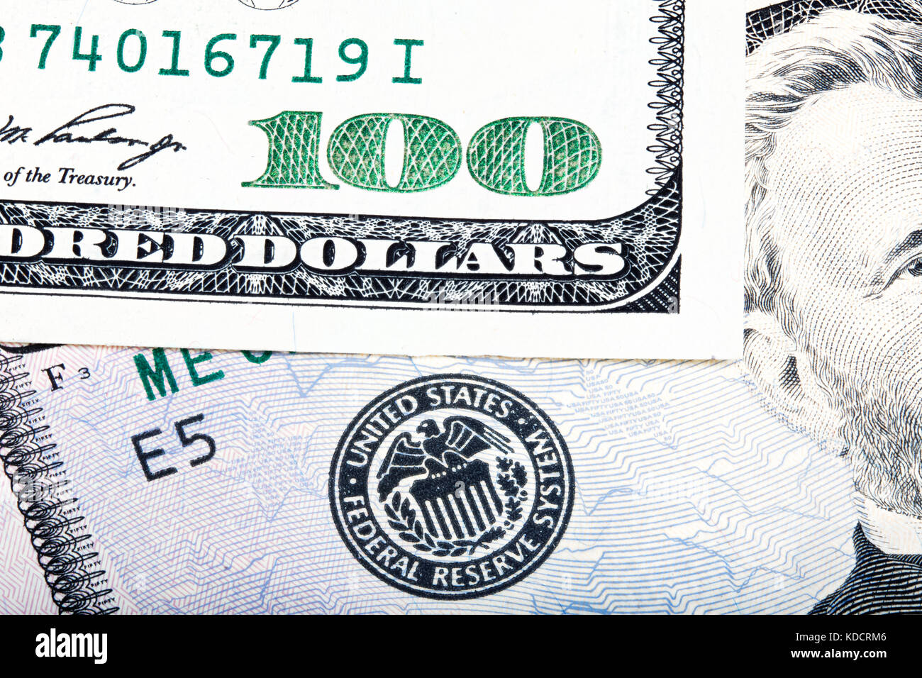 Hundred dollar near seal of Federal Reserve System. Stacked macr Stock Photo