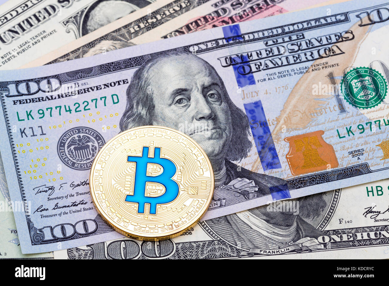 Closeup of golden blue bitcoin, macro shot.  Stock Photo