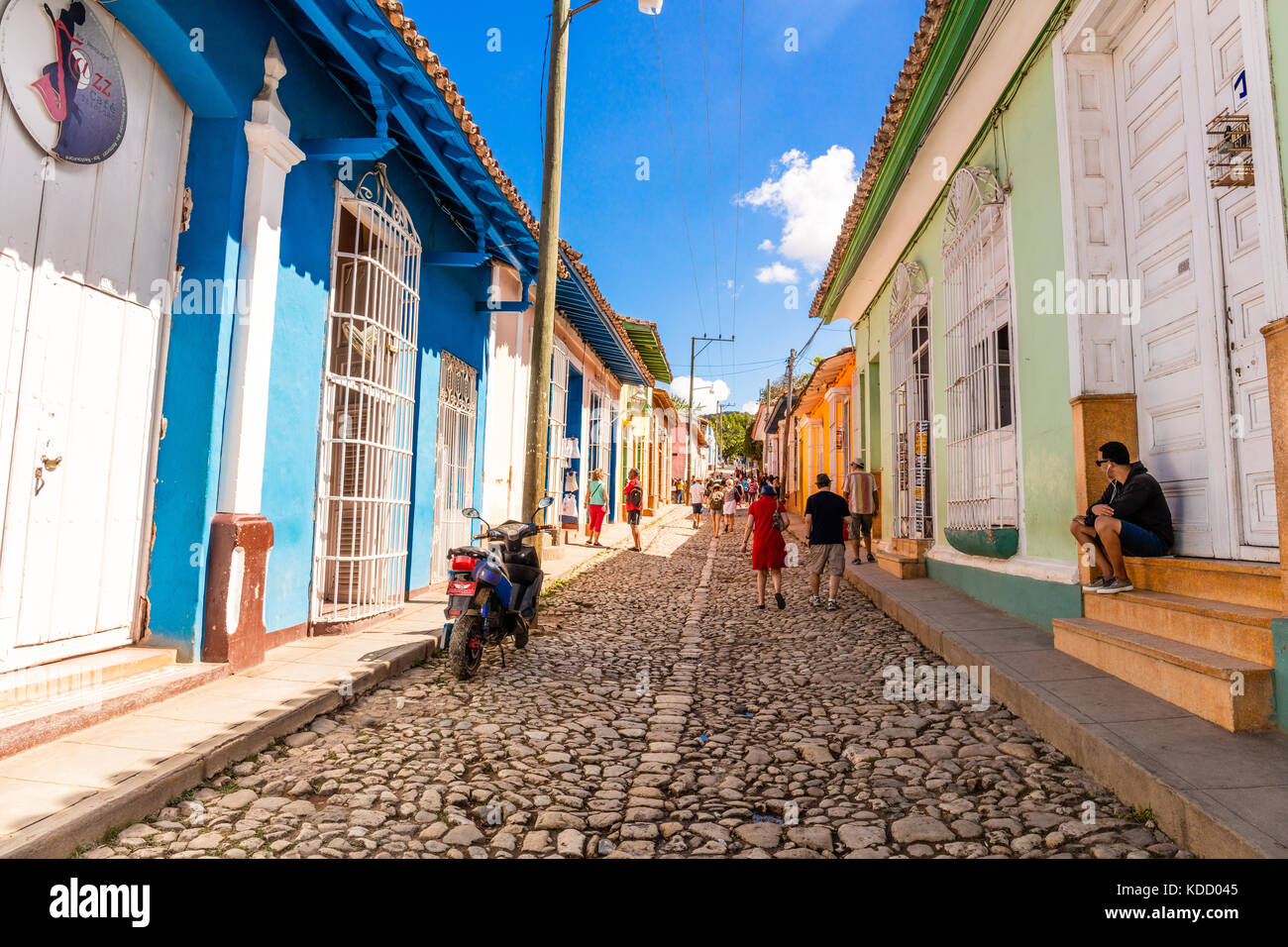 Spanish Colonial architecture with colourful houses,  cobblestone streets and people in a street scene, Trinidad,  Sancti Spíritus, Cuba, Caribbean Stock Photo