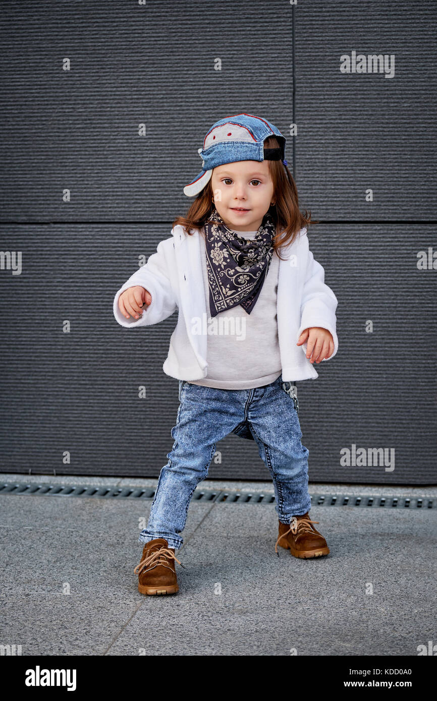fashion baby girl hip hop.a little girl in a baseball cap. Stock Photo