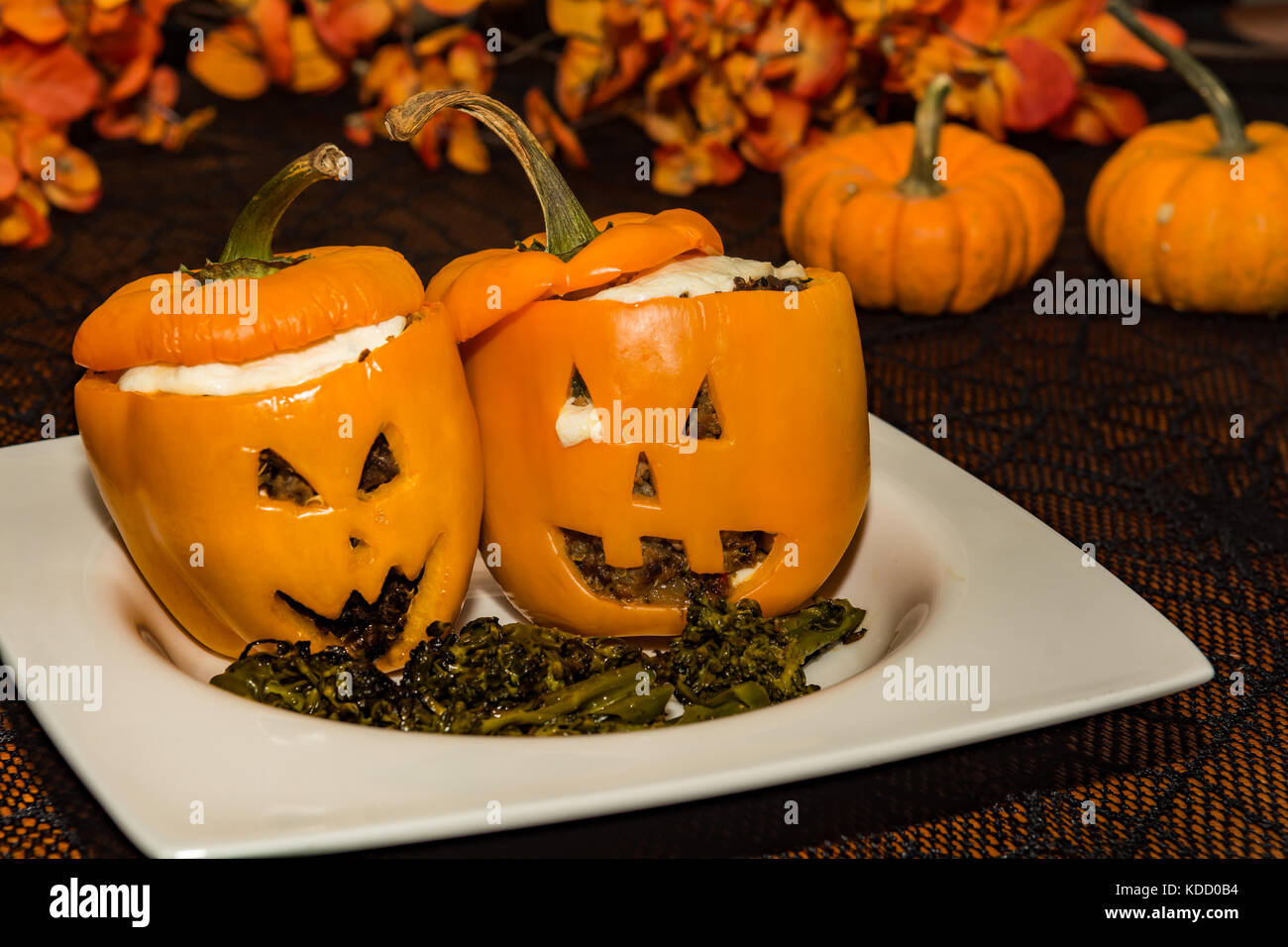 Jack O Lantern Stuffed Peppers Served At A Halloween Party Stock Photo Alamy