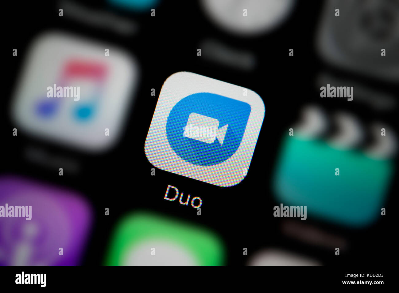 A close-up shot of the logo representing Google Duo app icon, as seen on the screen of a smart phone (Editorial use only) Stock Photo