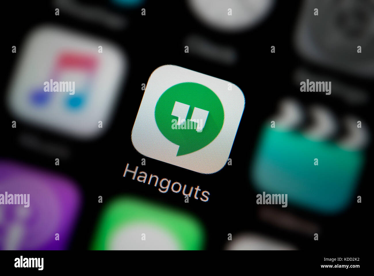 A close-up shot of the logo representing Google Hangouts app icon, as seen on the screen of a smart phone (Editorial use only) Stock Photo