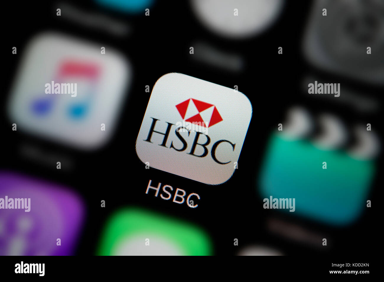 A close-up shot of the logo representing HSBC Bank app icon, as seen on the screen of a smart phone (Editorial use only) Stock Photo