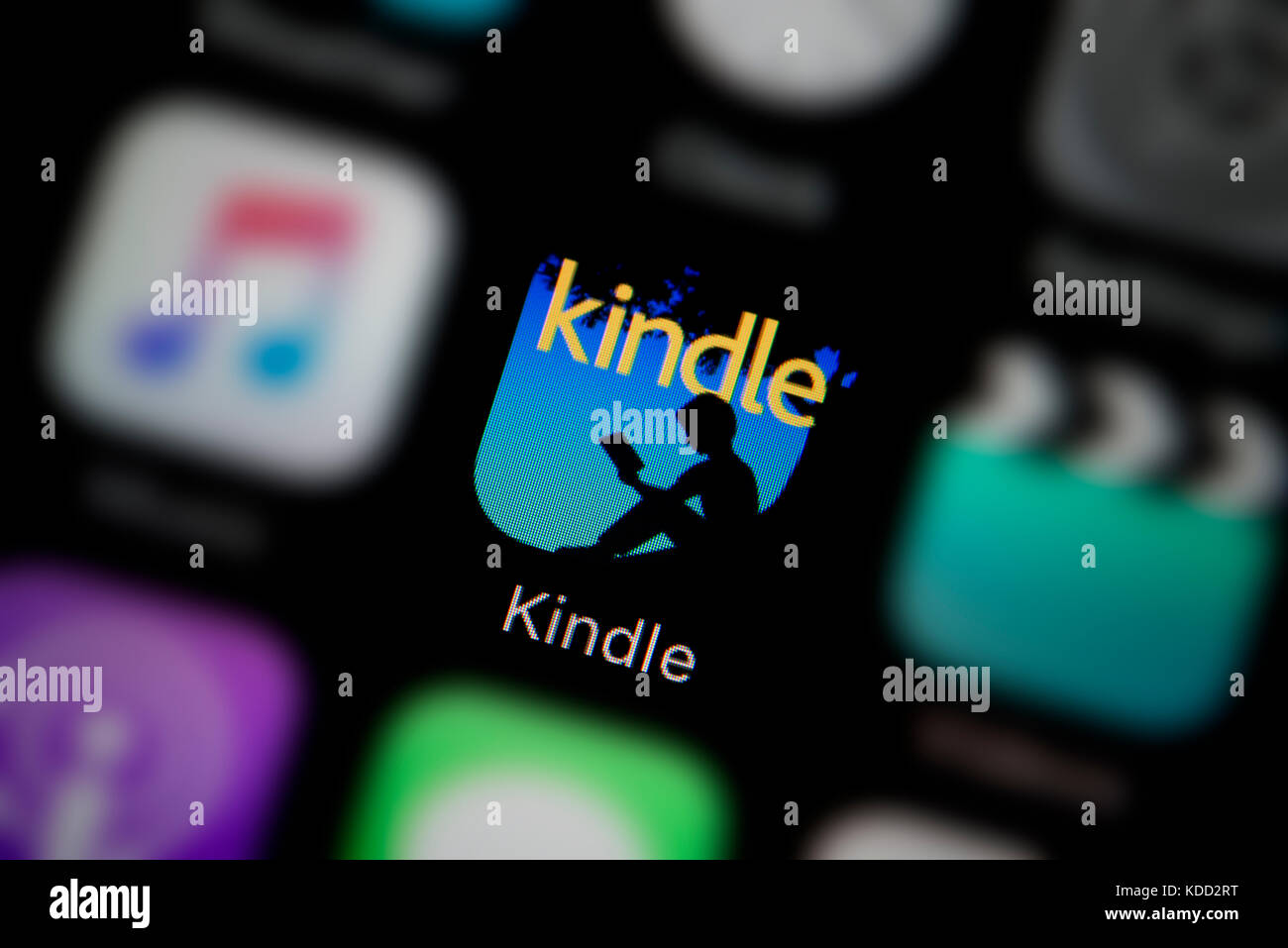 A close-up shot of the logo representing Kindle app icon, as seen on the screen of a smart phone (Editorial use only) Stock Photo