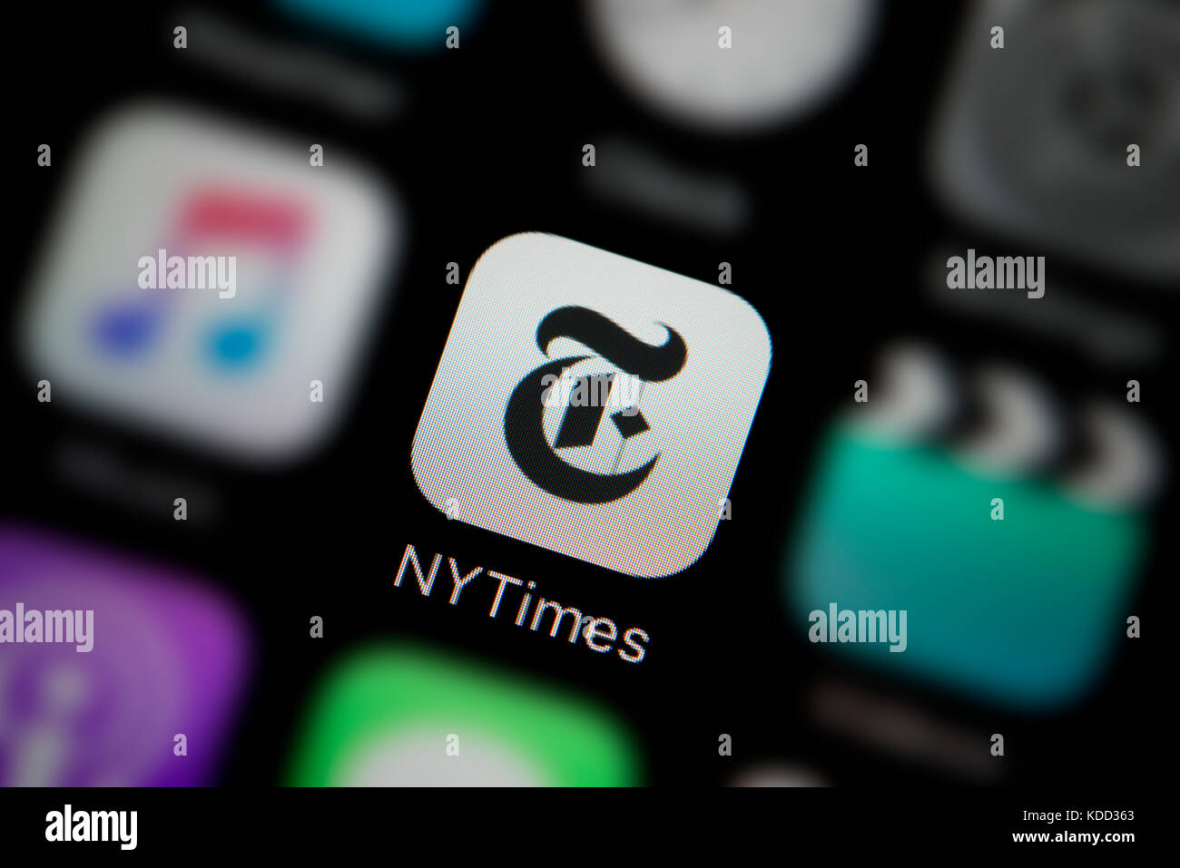 A close-up shot of the logo representing New York Times app icon, as seen on the screen of a smart phone (Editorial use only) Stock Photo