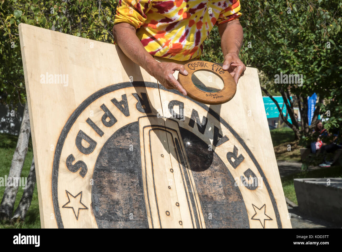 Grand Rapids, Michigan - A man burns a design on wood during the annual ArtPrize competition. Stock Photo