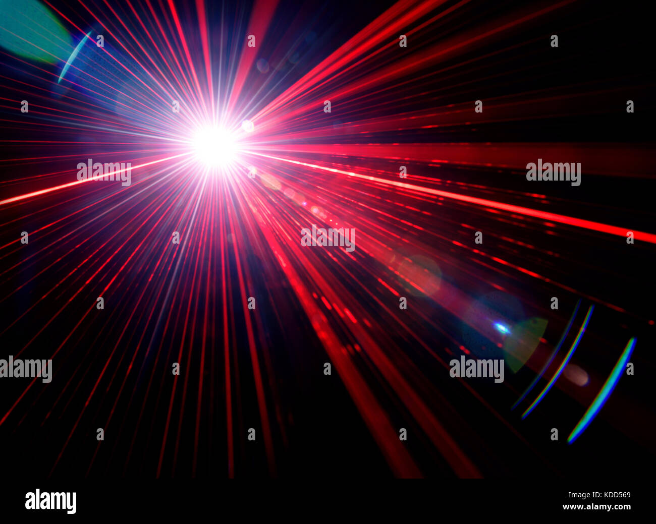 Red stage light with lens flare on black background, photo Photo Alamy