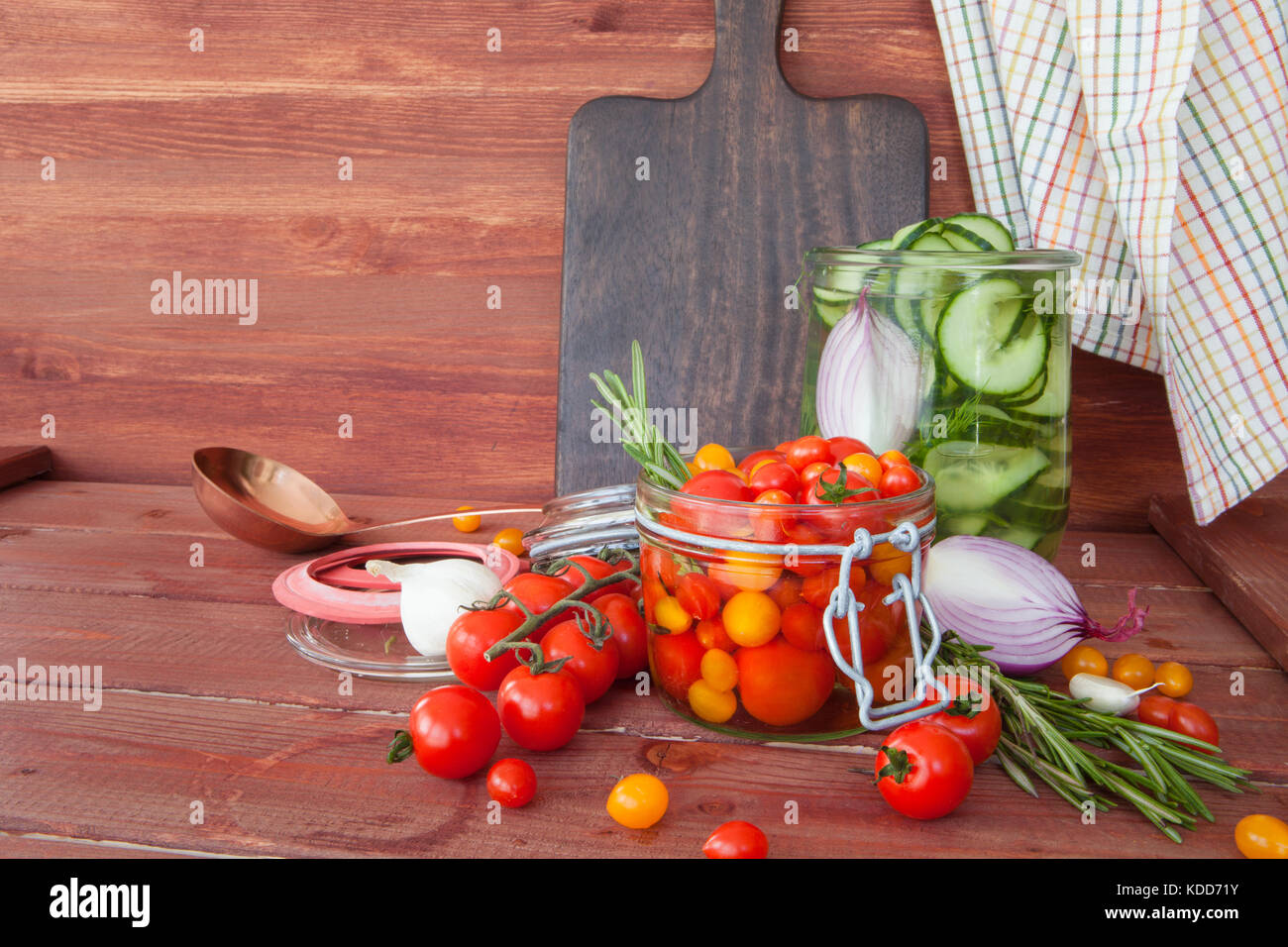 Pickling fresh vegetables with rosemary and garlic Stock Photo