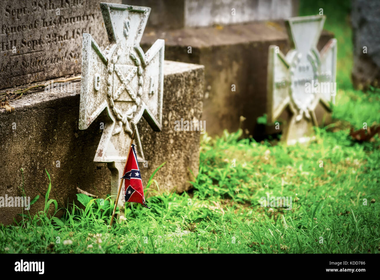A miniature confederate flag on a Civil War veteran's grave in Virginia. Stock Photo