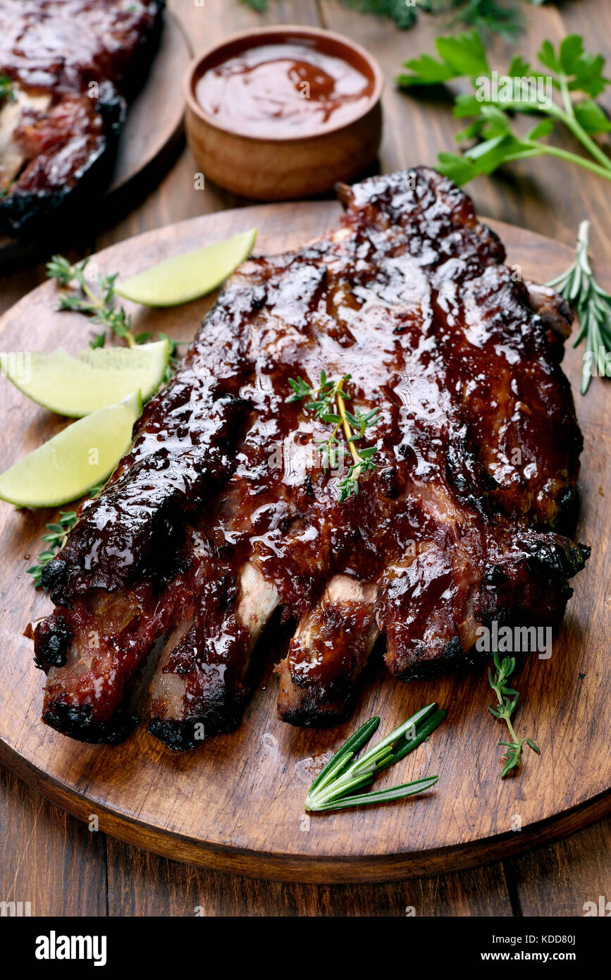 Barbecue pork ribs on wooden board Stock Photo
