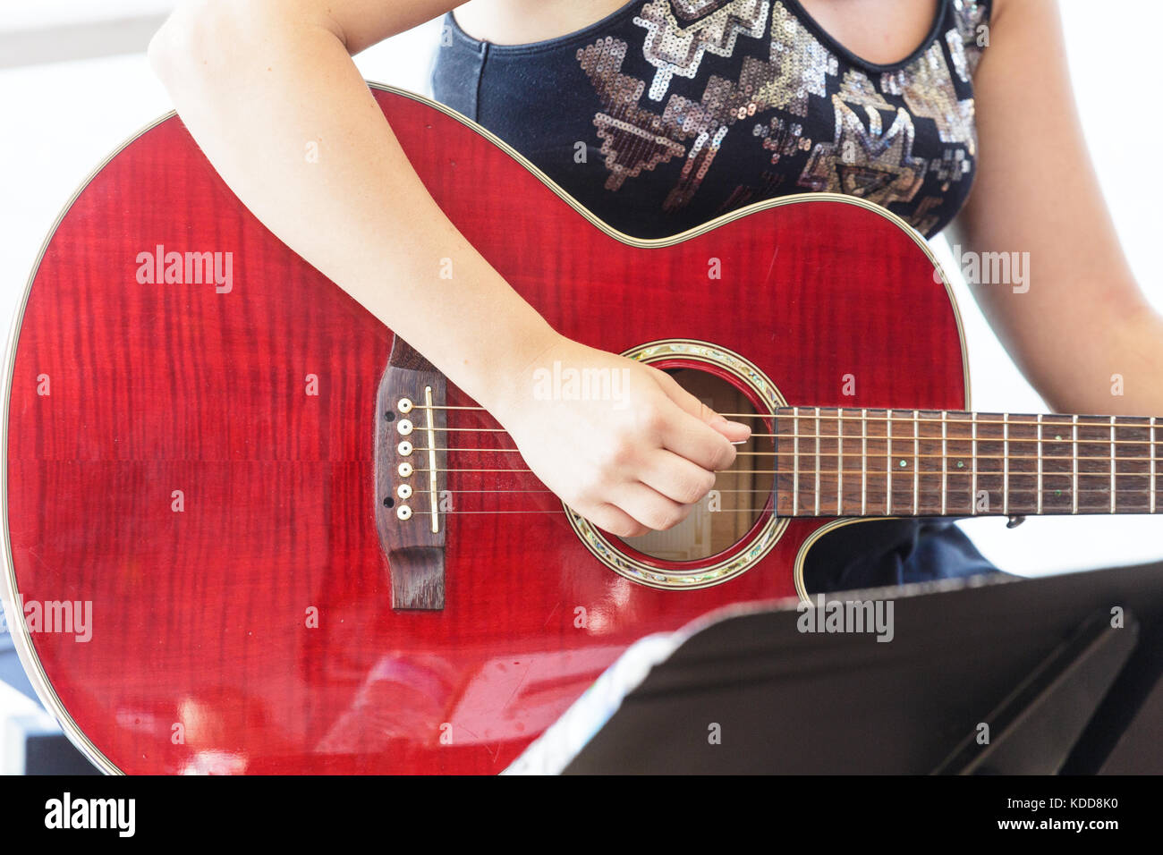A woman Playing Red Guitar Stock Photo - Alamy