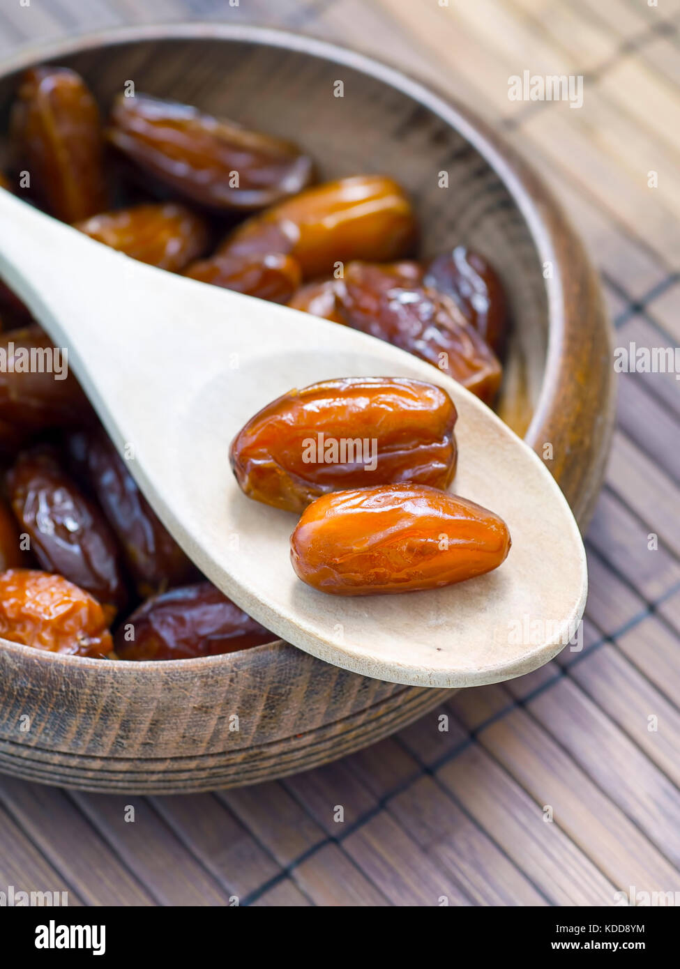 Dates fruit closeup on wooden ladle rustic background Stock Photo - Alamy