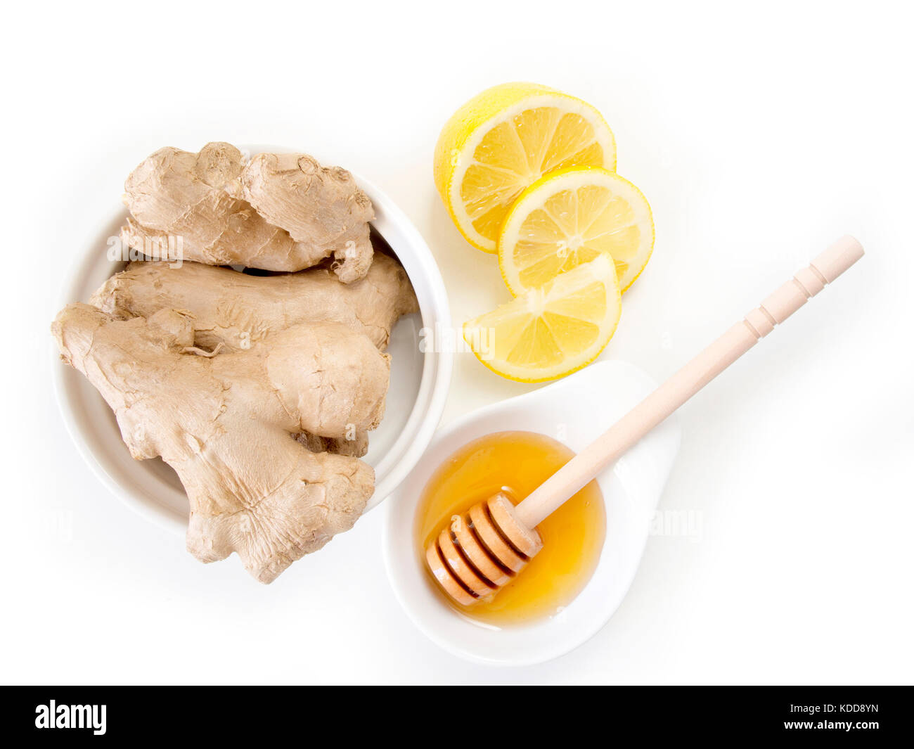Natural cold and flu remedy. Ginger, lemon and honey isolated on white
