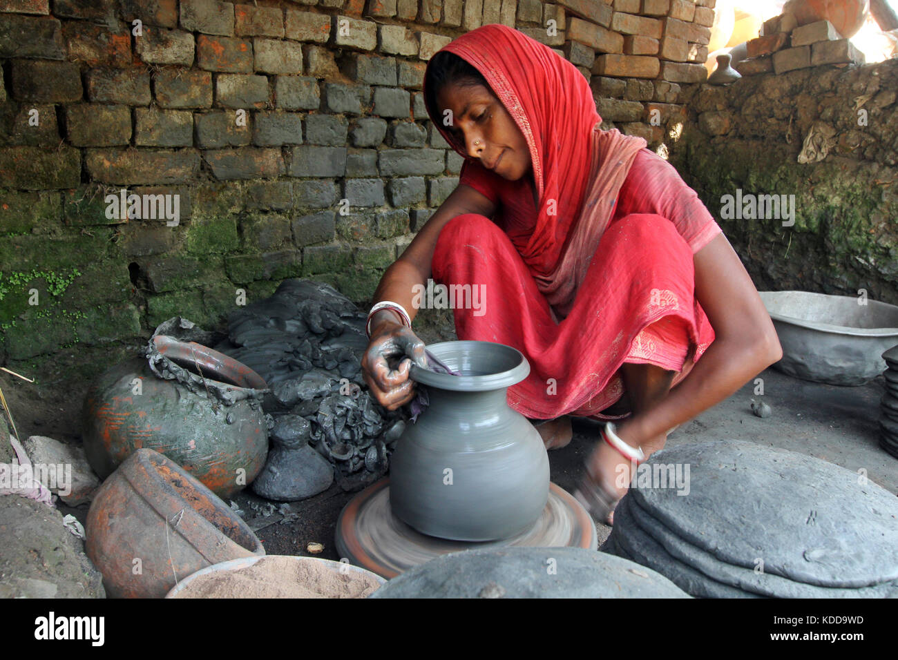 Khulna, Bangladesh Potter makes clay pot using a traditional wheel at