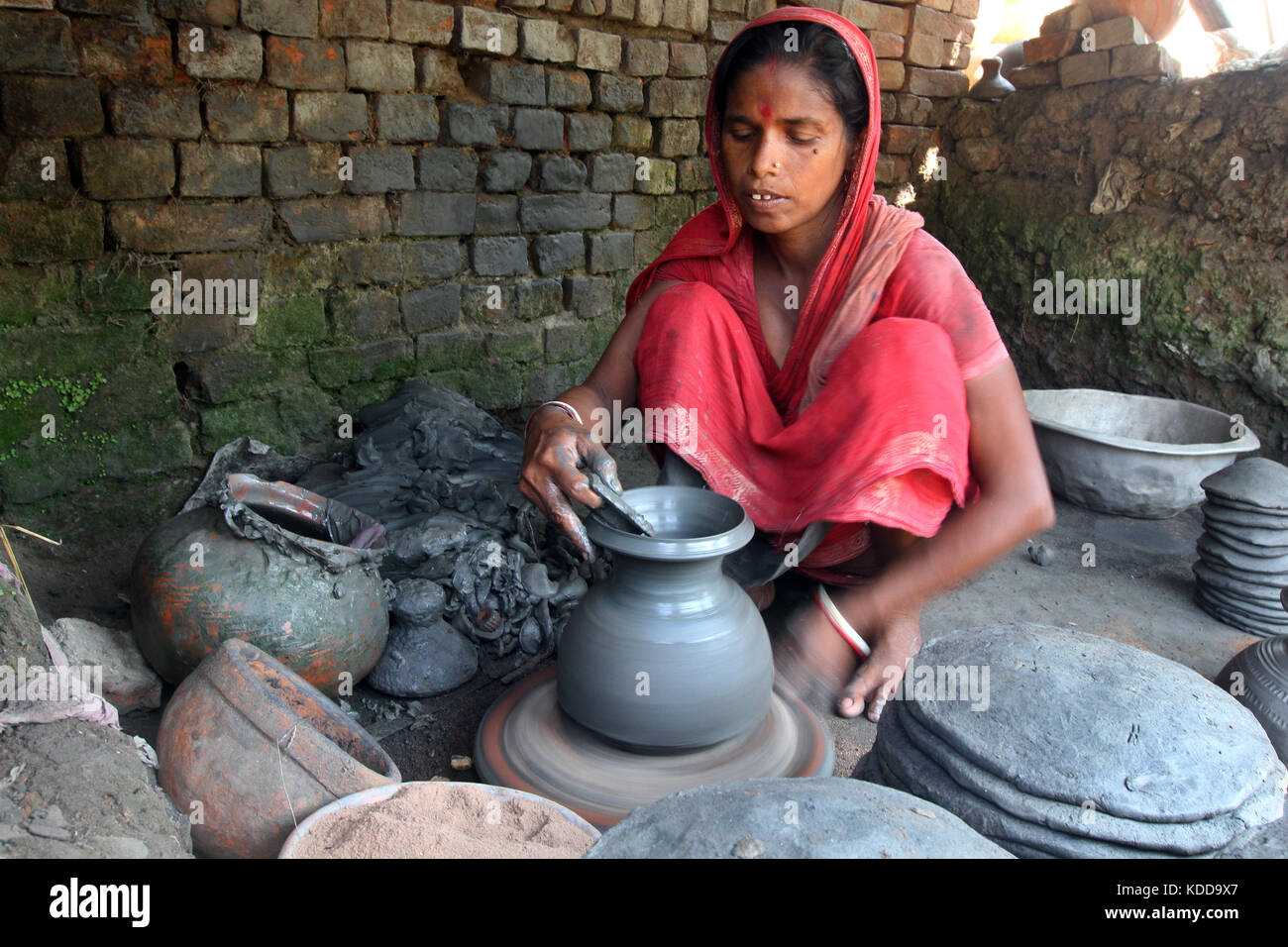 Khulna, Bangladesh Potter makes clay pot using a traditional wheel at
