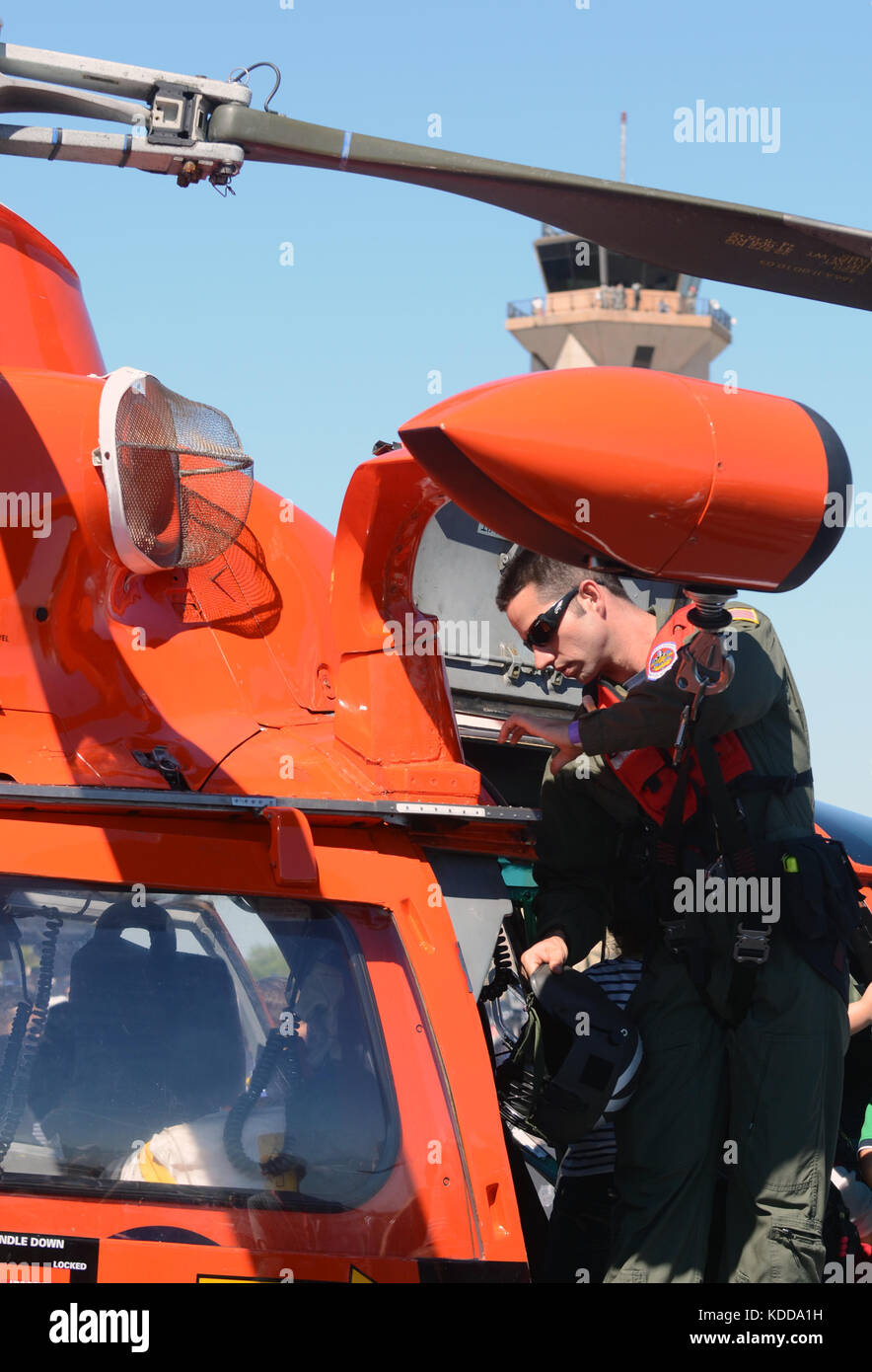 MIAMI - NOVEMBER 3: US Coast Guard pilot prepareshis helicopter for flight on November 3, 2012 at Opa Locka airport in Miami, Florida Stock Photo