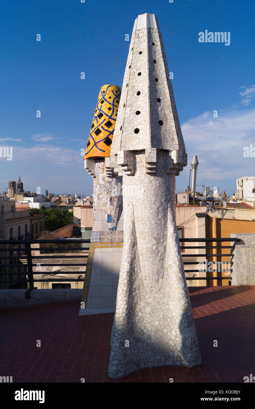 A pair of Gaudi Chimneys on the roof of Palau Guell, a short distance from La Rambla in Barcelona Stock Photo