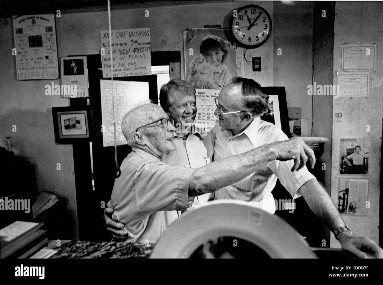 President Jimmy Carter visits with his uncle Alton Carter (left) and