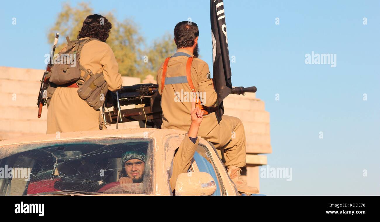 Undated ISIS propaganda image showing Islamic State fighters preparing ...