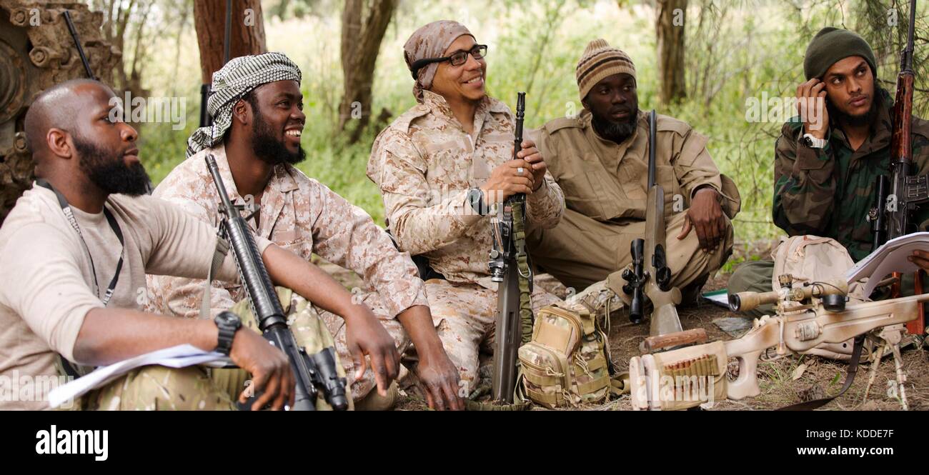 Undated ISIS propaganda image showing Abu Sa’d at-Trinidadi, center, with a group of fellow militants from Trinidad and Tobago during military training in Syria. Stock Photo