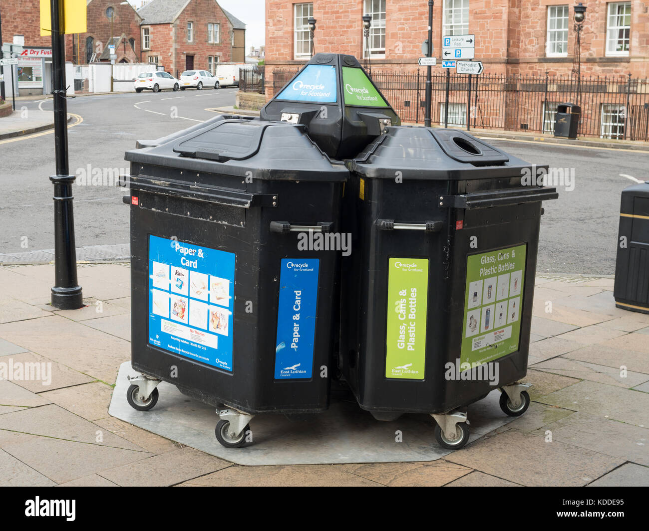 Segregated 3 bay recycling bins on a street corner in the centre of Dunbar, Scotland, UK Stock Photo