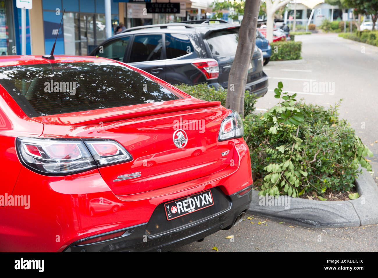 Rear boot of Holden SS Commodore saloon car in red,Forster,NSW, Australia Stock Photo