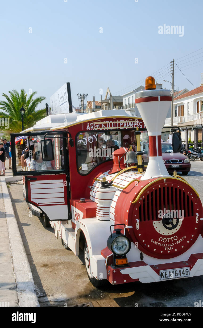 Red Argostoli Express Tourist Train stopped on street, Argostoli, Kefalonia, Cephalonia, Ionian Islands, Greece. Stock Photo