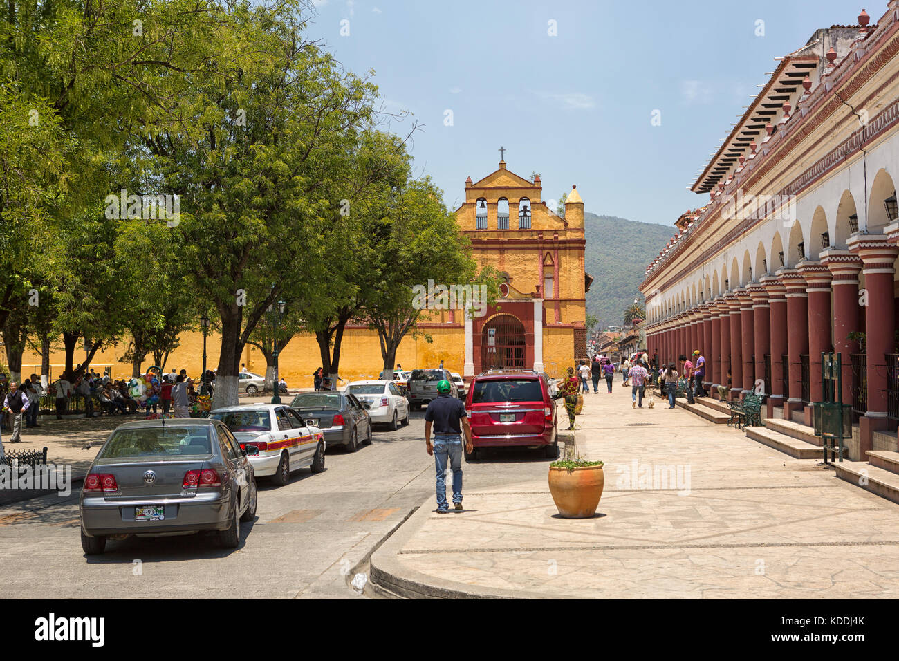 April13, 2014 San Cristobal de las Casas, Mexico: cars lining up on the street in the historic center of the colonial tourist town Stock Photo