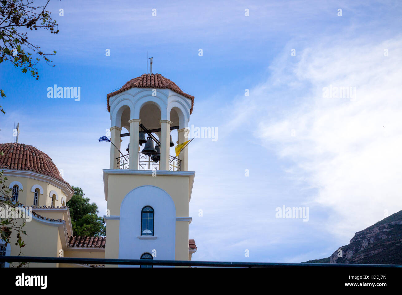 greek orthodox church tower bell with blue sky on the background Stock Photo